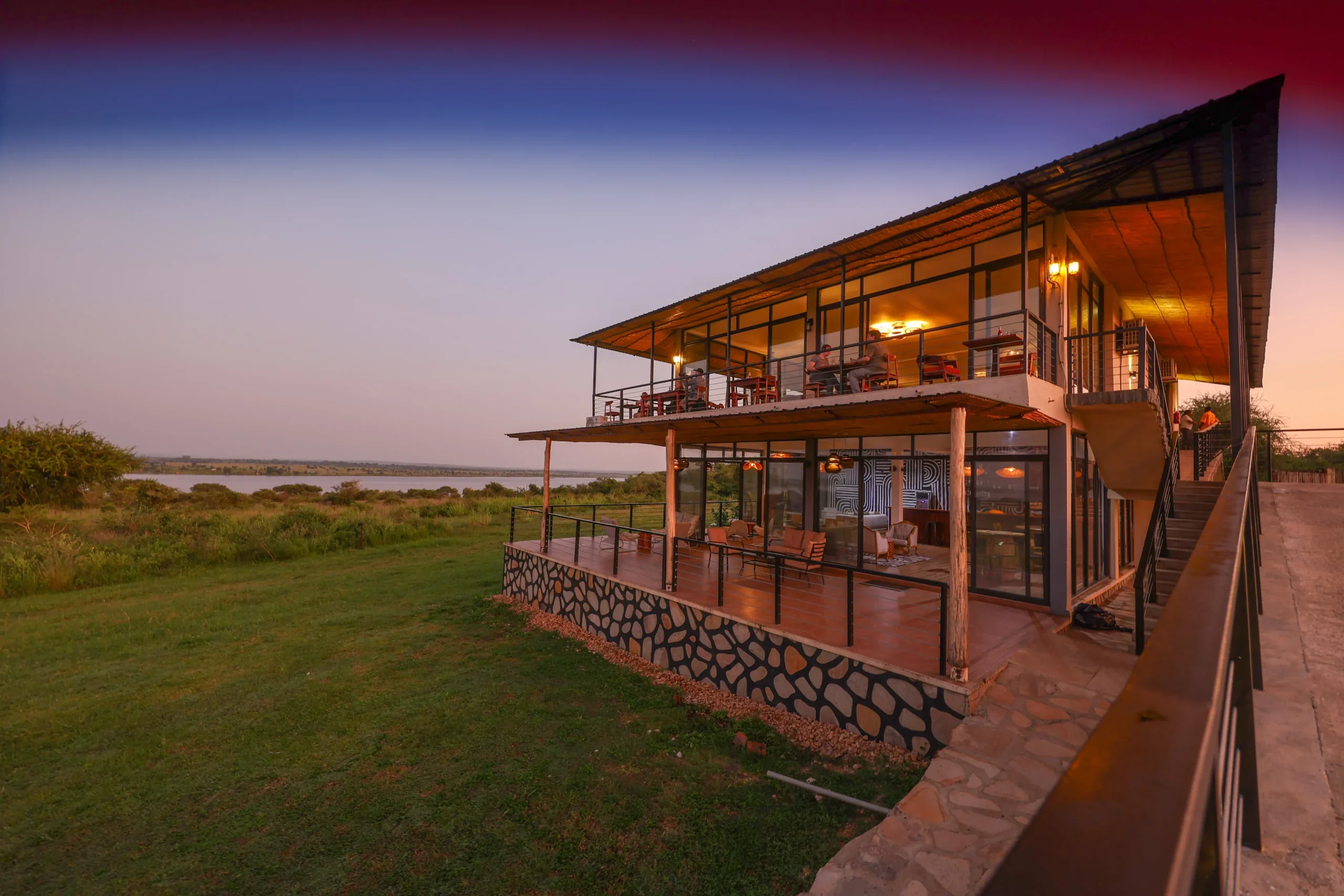 The main building at sunset with the river beyond