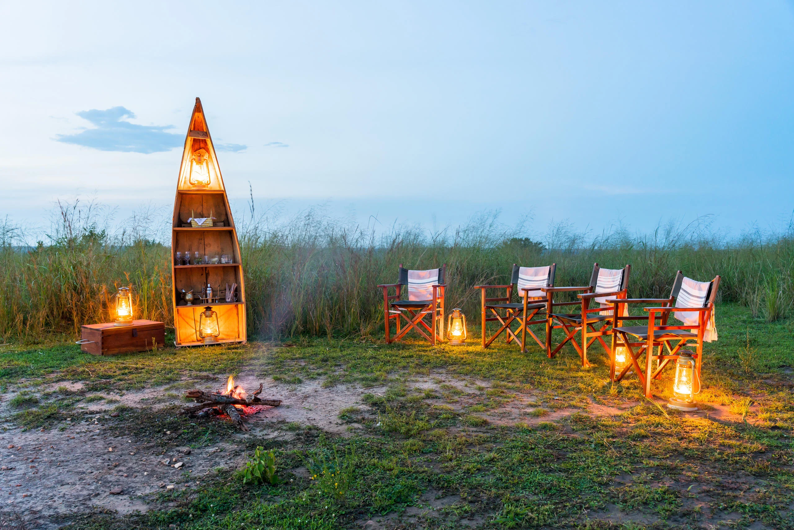 Chairs around the campfire at dusk