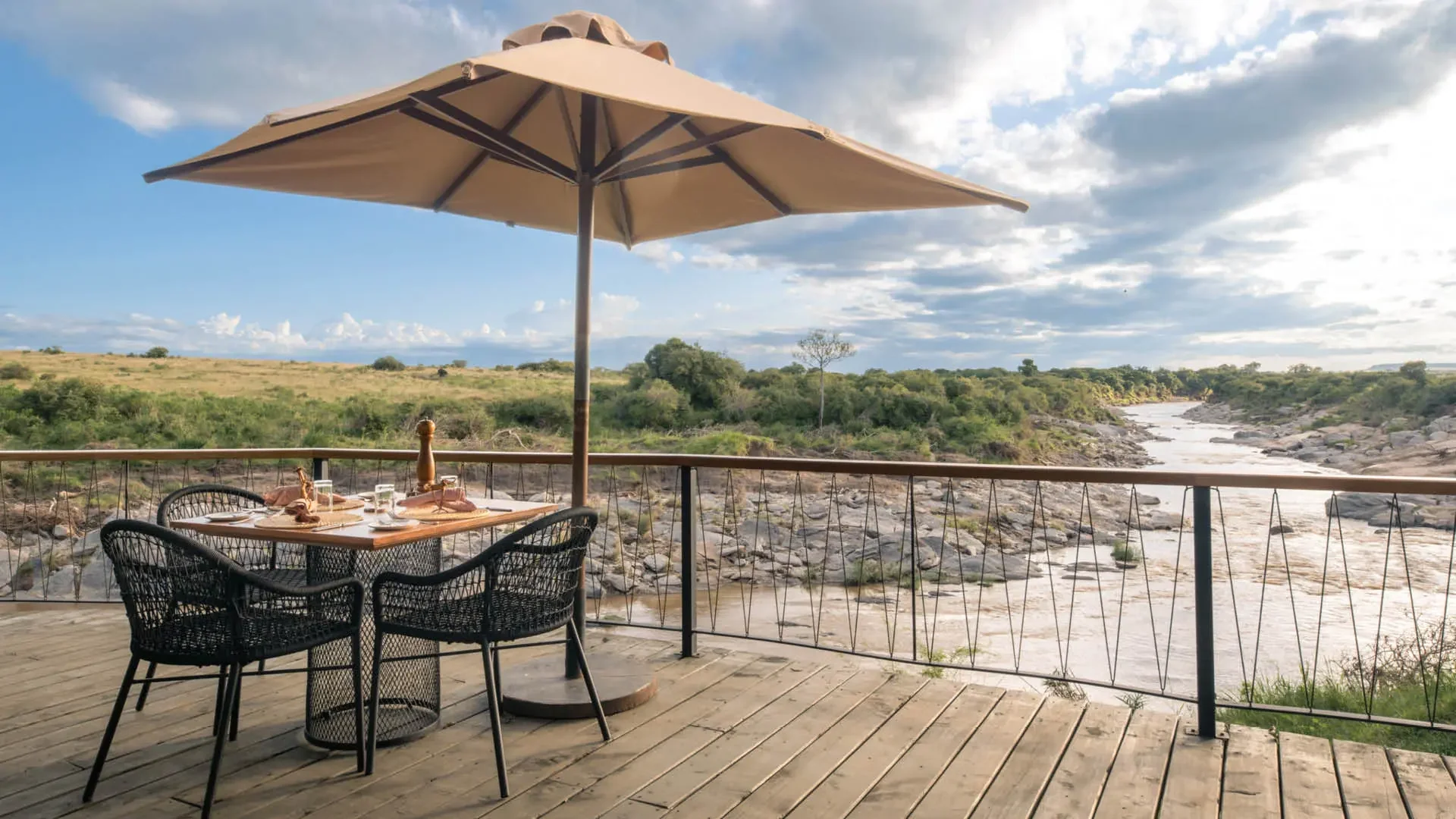 A table under a parasol above the river