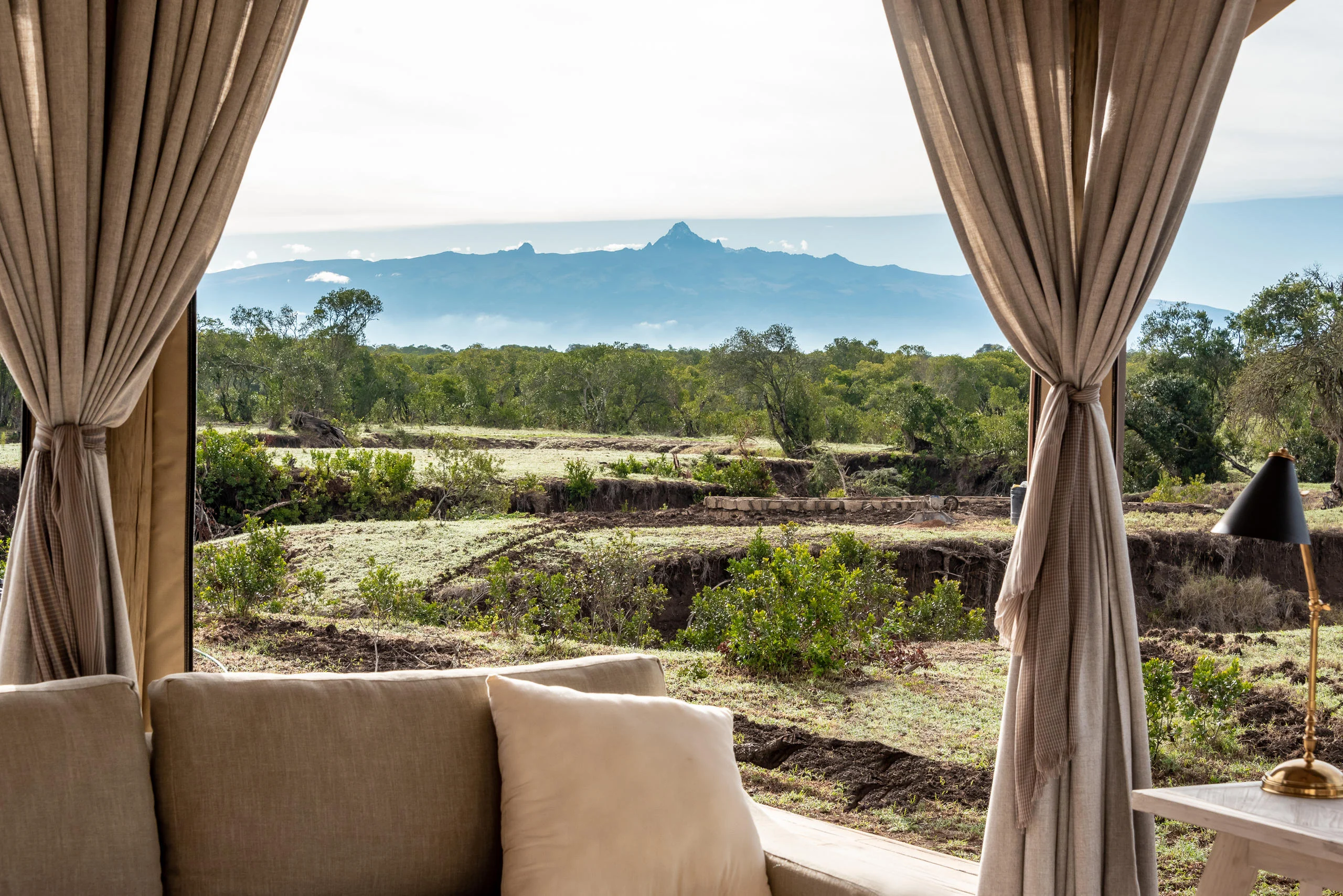 A tent looking out to Mount Kenya across the plains