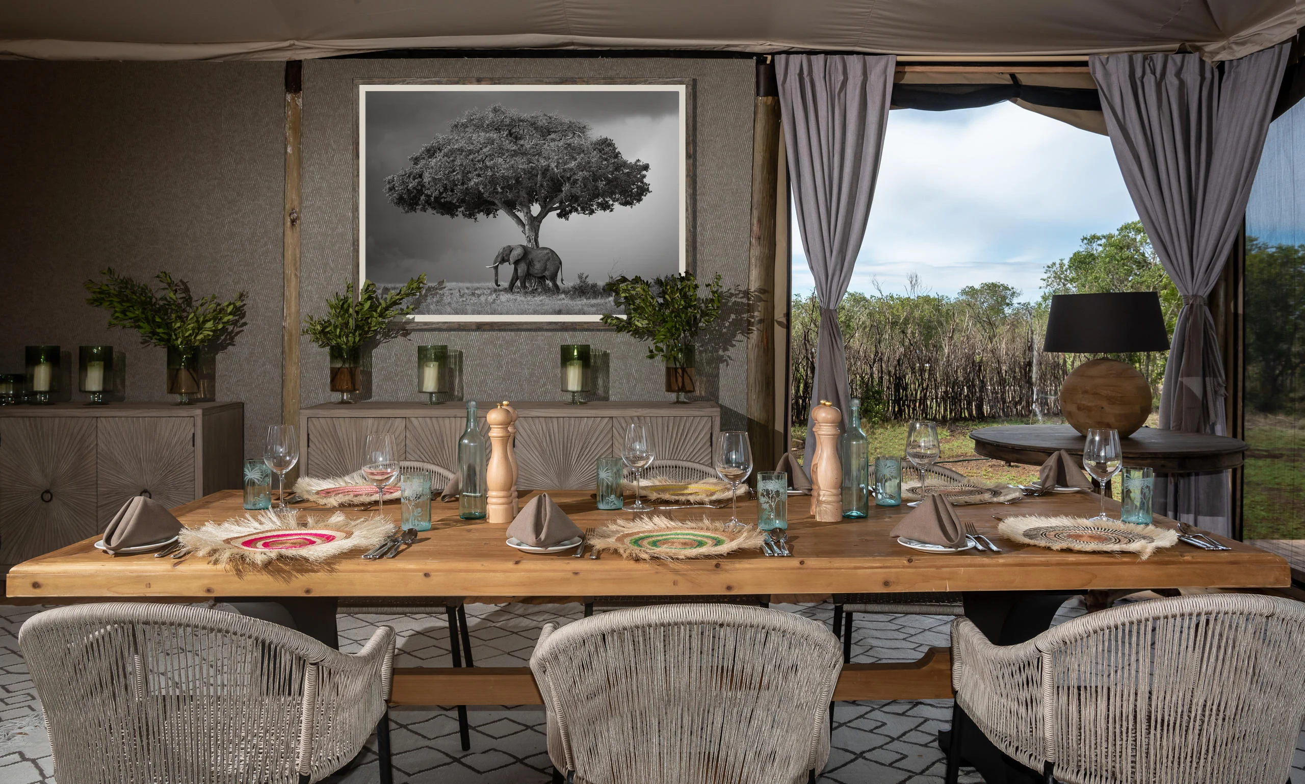 The dining table laid beneath a framed photograph