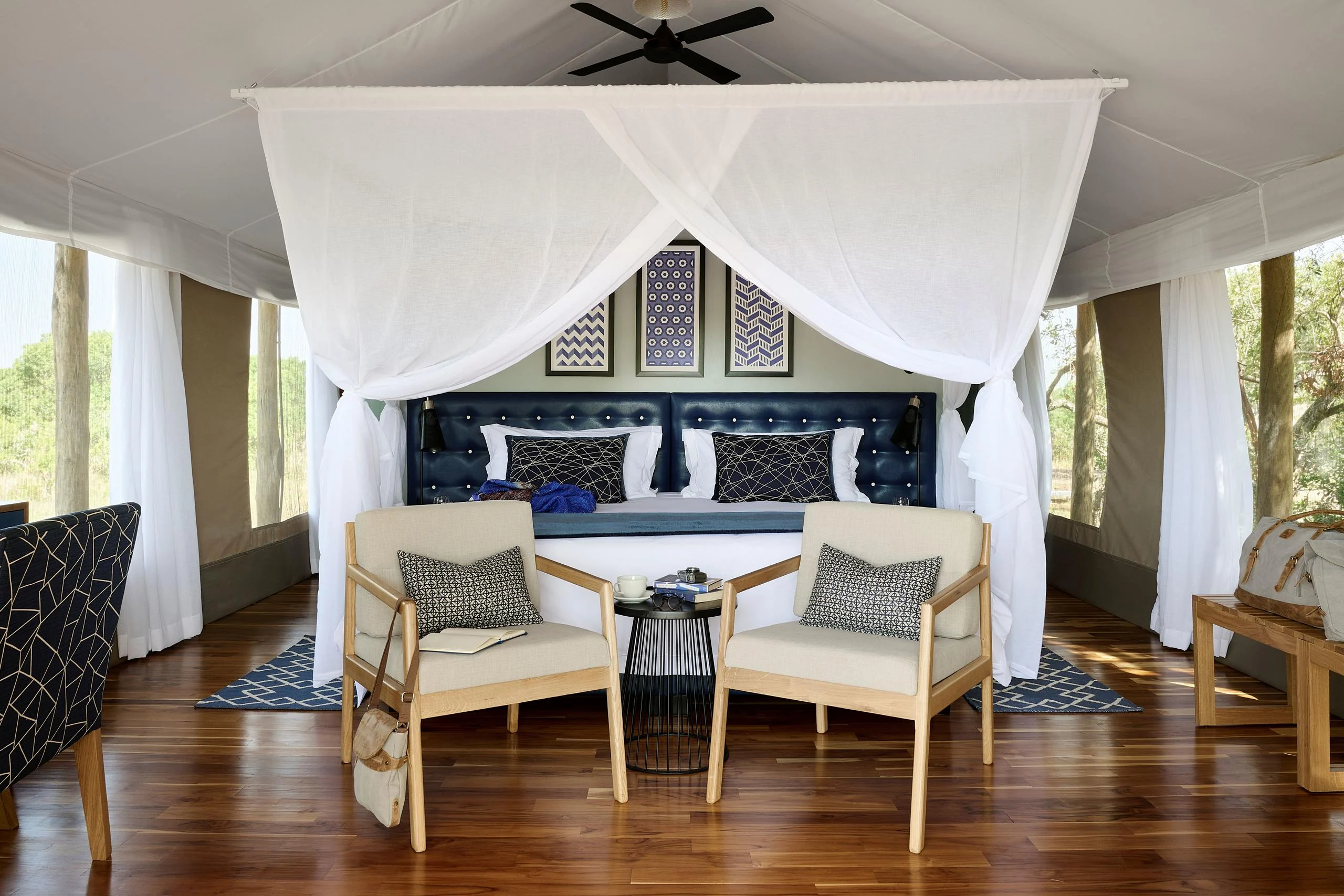 A tent bedroom with a four-poster bed
