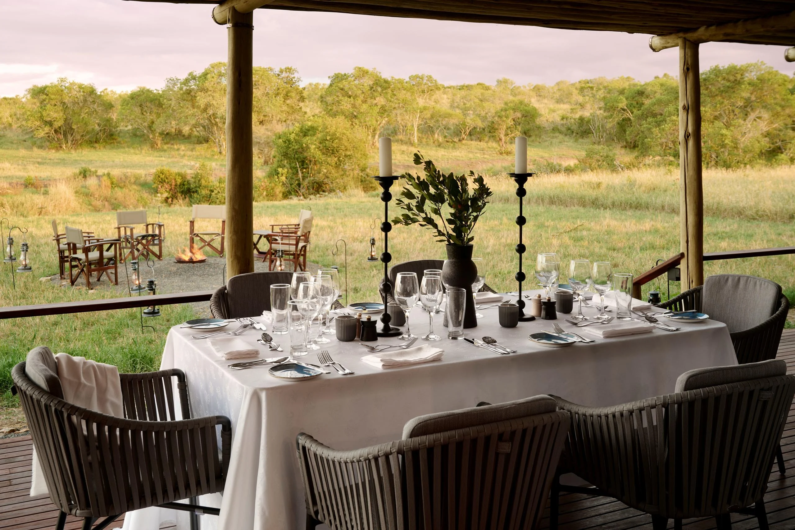 A dinner table laid on the deck