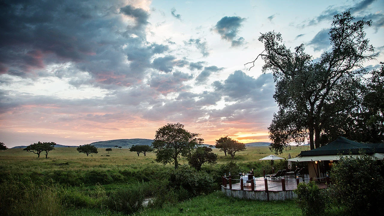 The camp beside the river at dusk