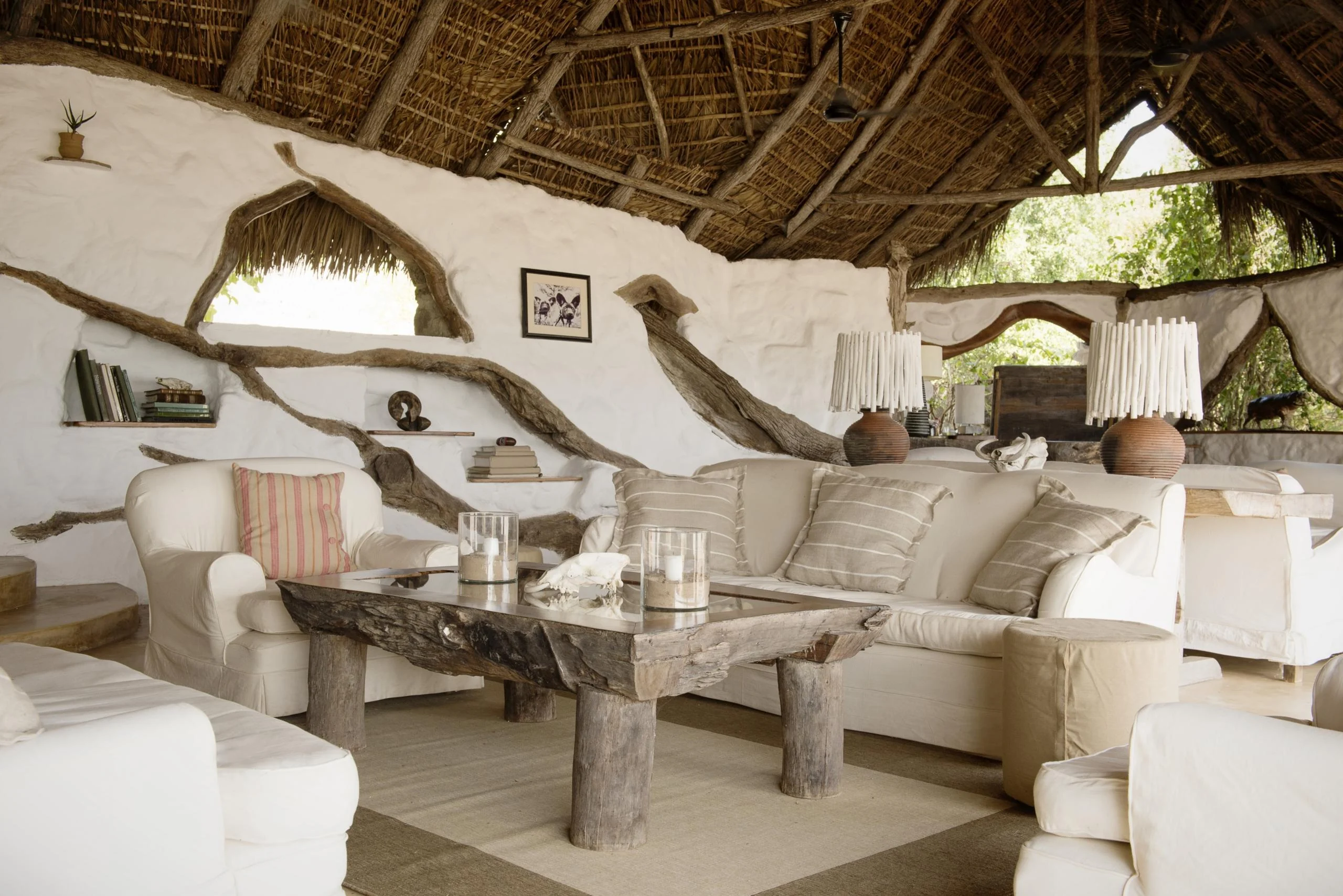 The lounge under thatch with pale sofas