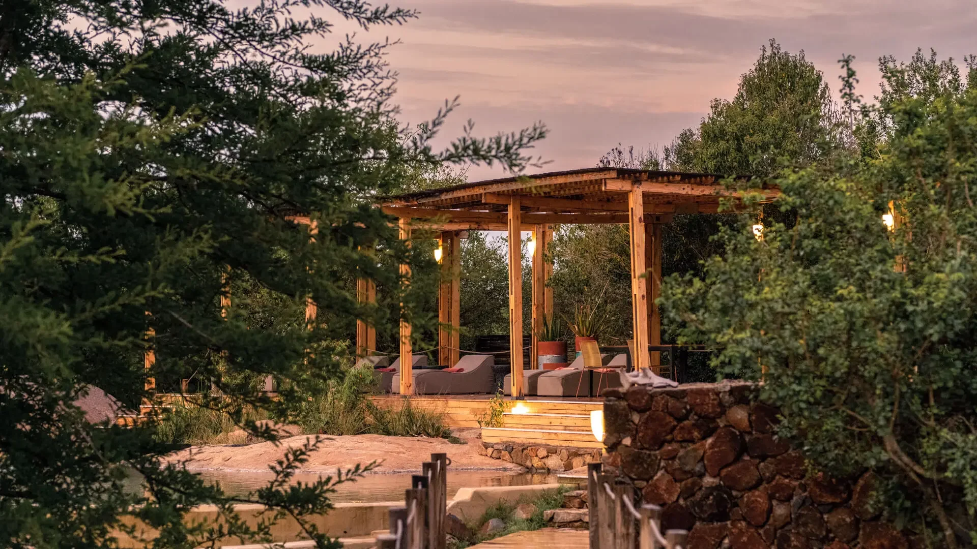 A guest tent at dusk among the trees