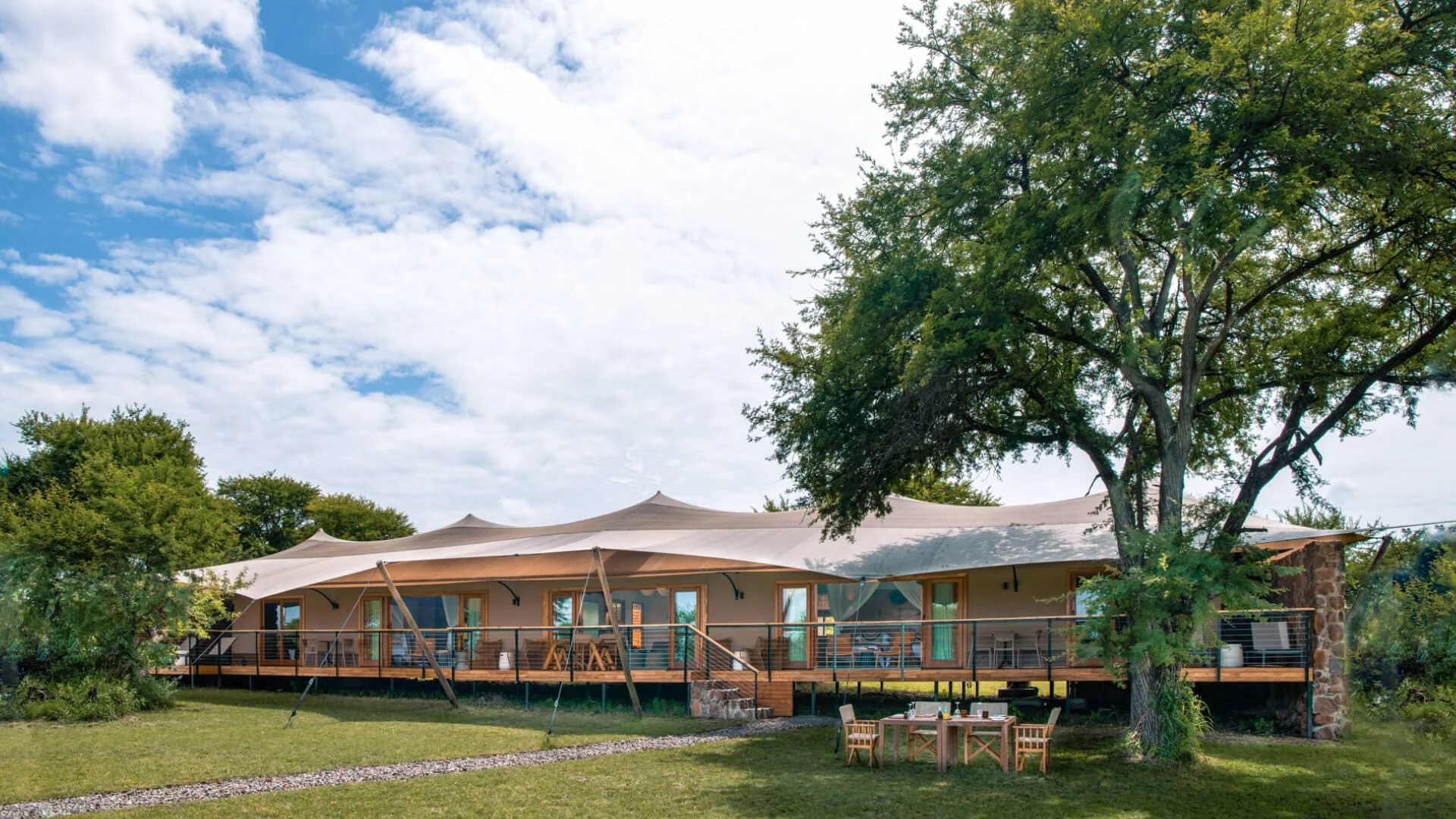 The retreat's main tent beneath a large tree