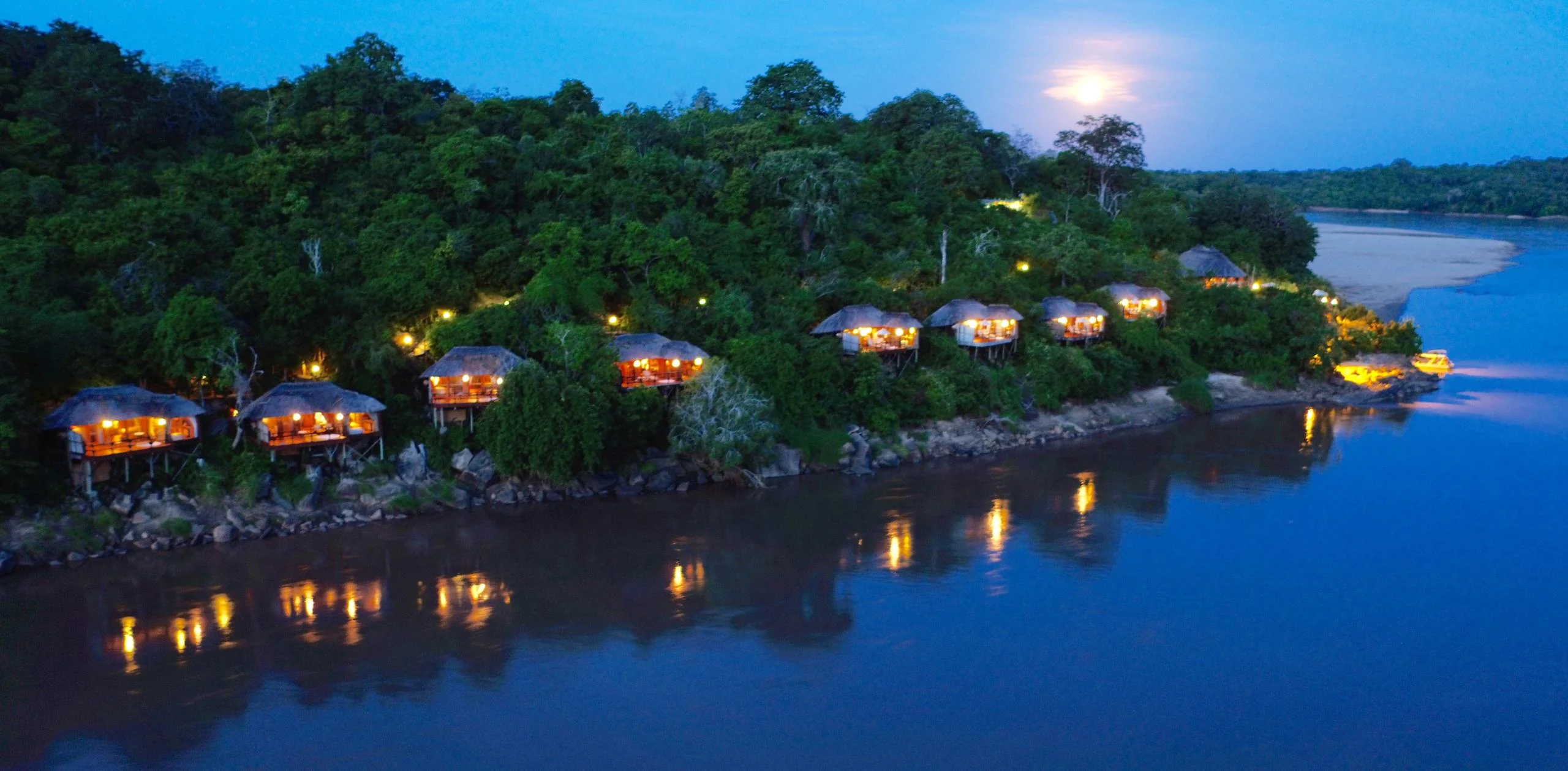 The lodge on the riverbank at dusk