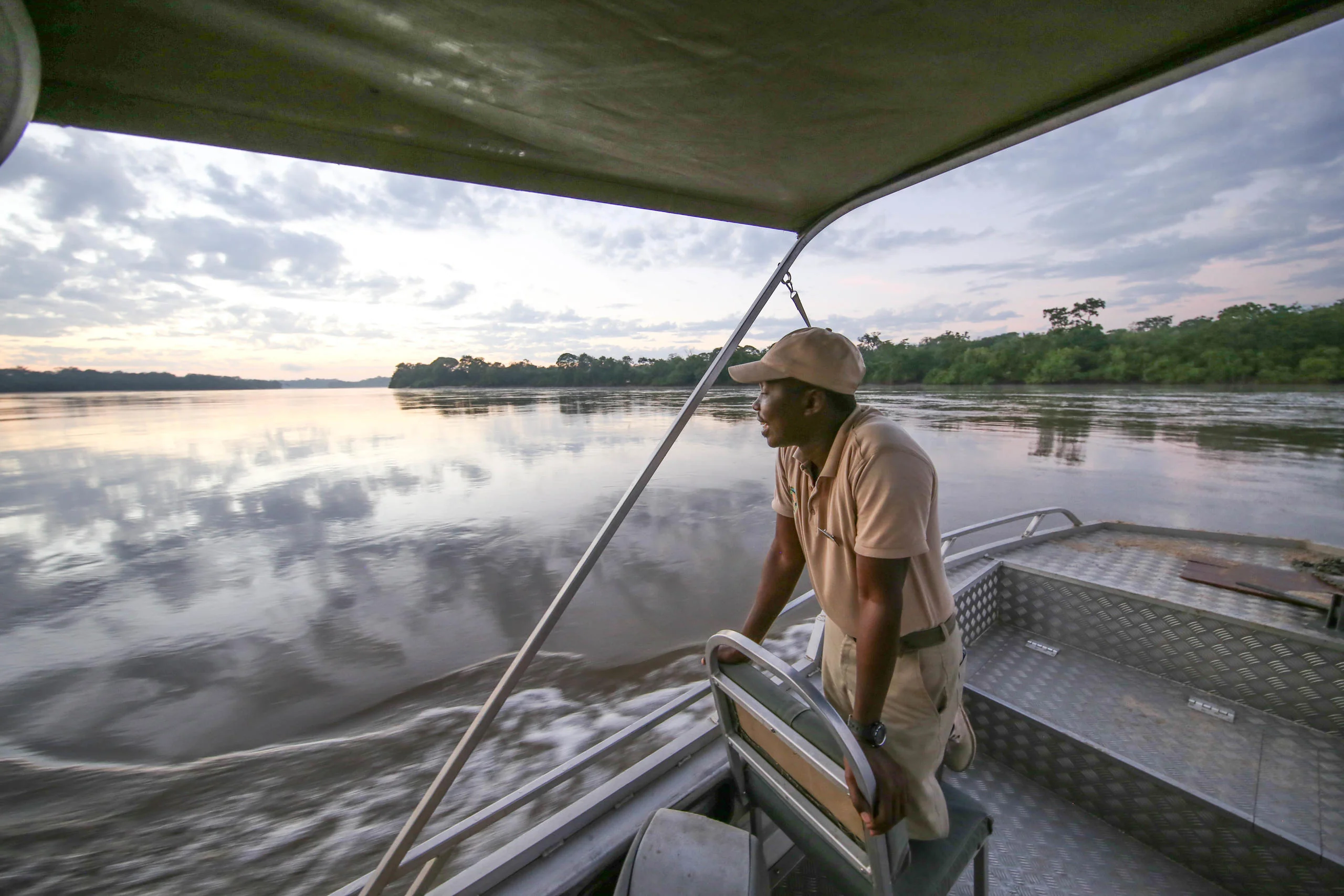 A guide on a boat on the river