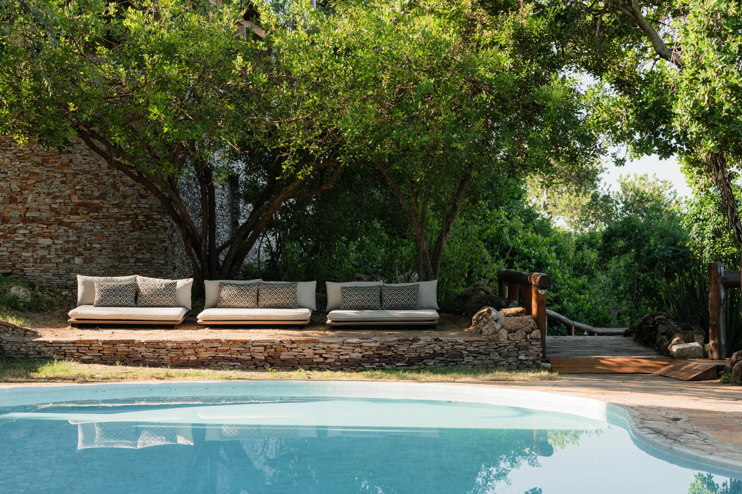 The swimming pool and shaded seating at Serengeti Migration Camp
