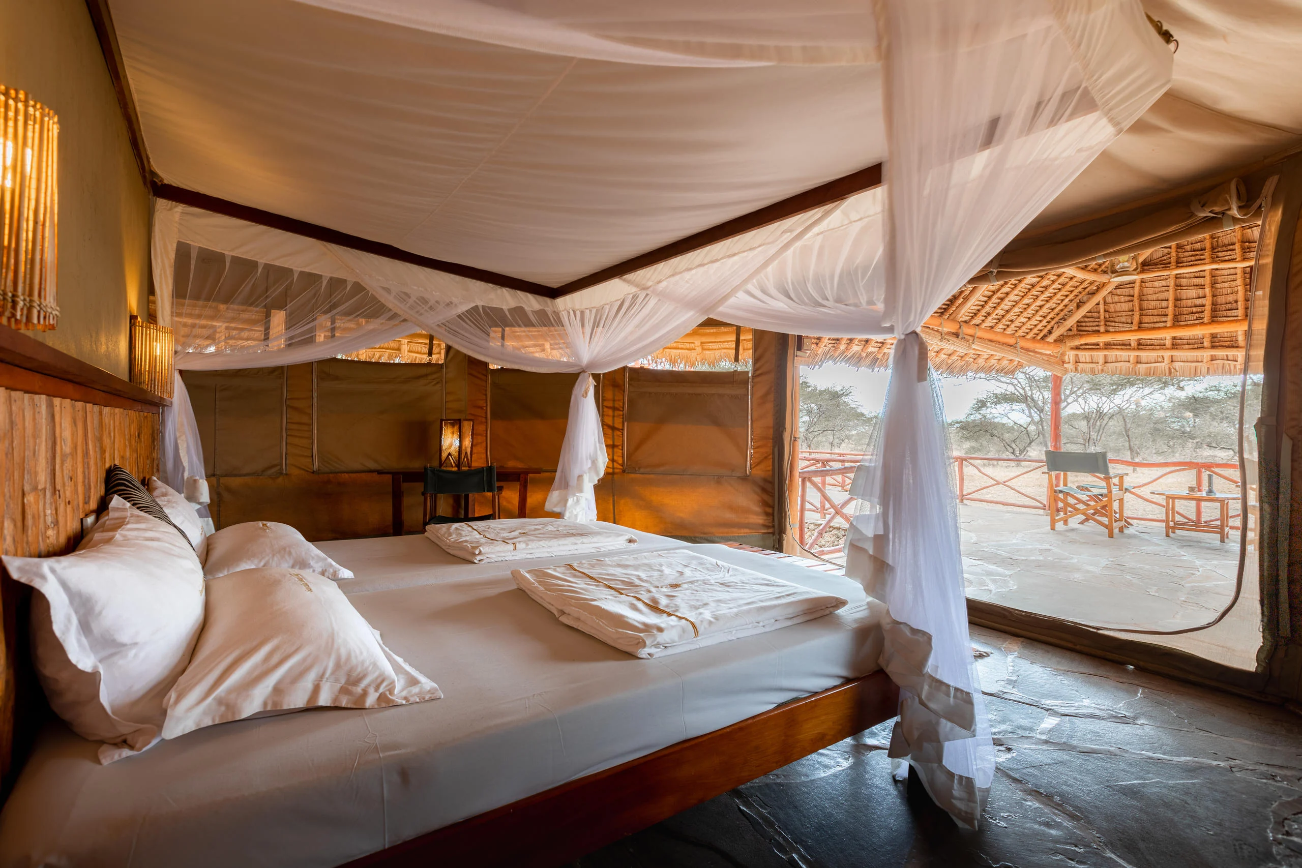 A tent bedroom open to the plains