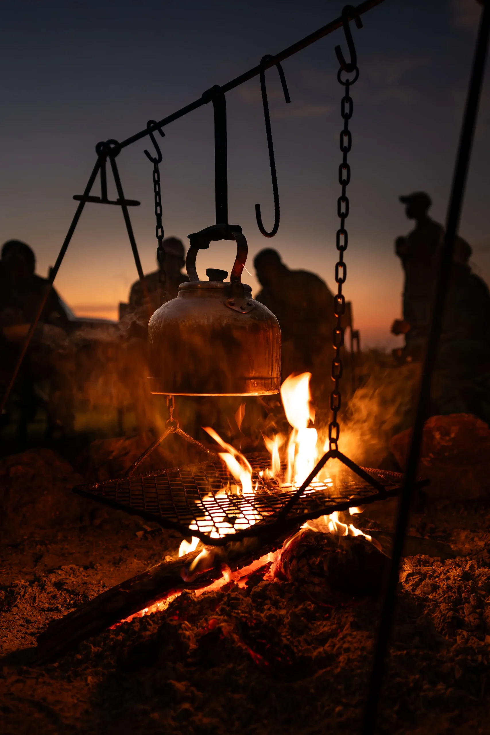 Cooking pots over the campfire at night