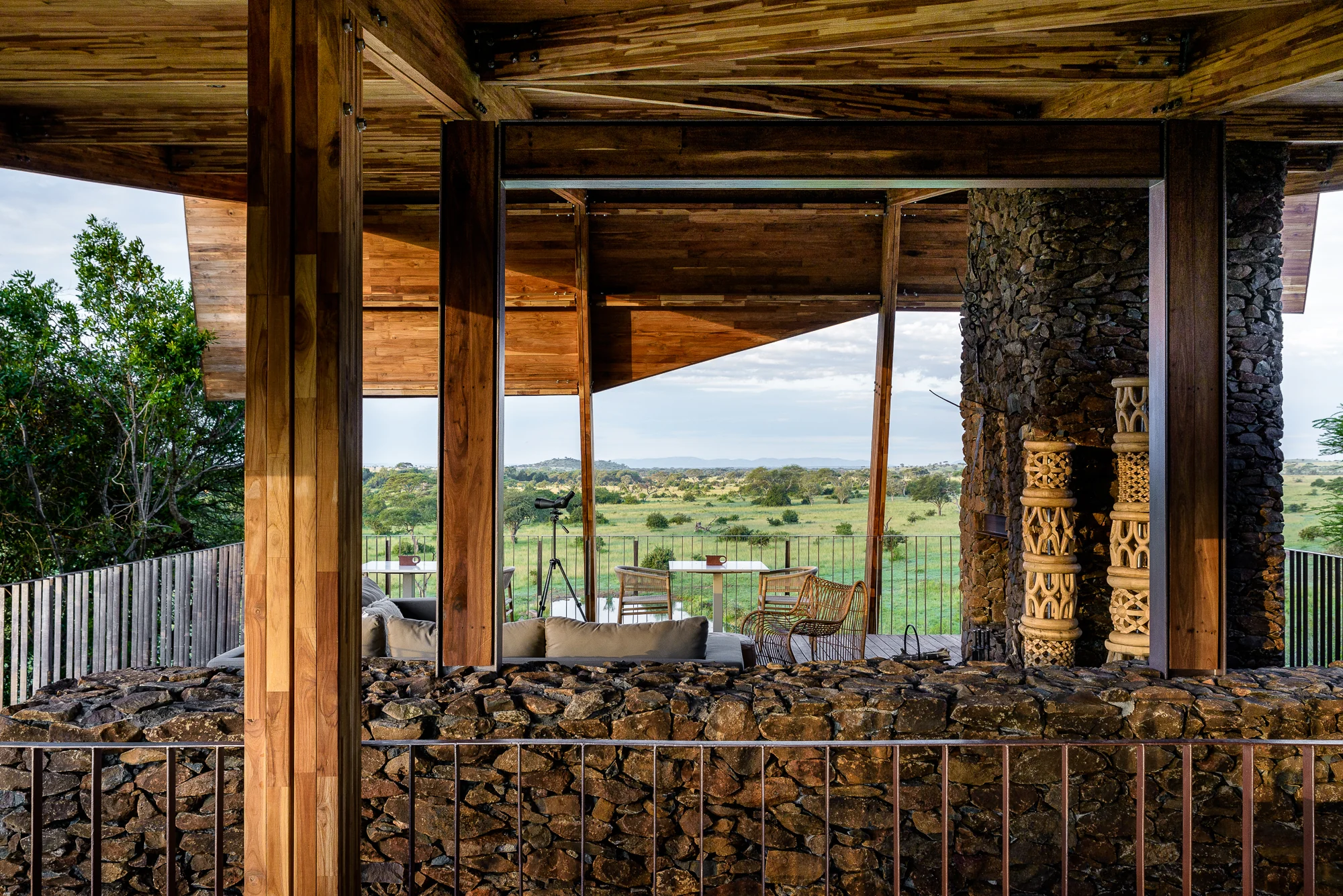 The main building with stone-filled gabion walls, open to the plains