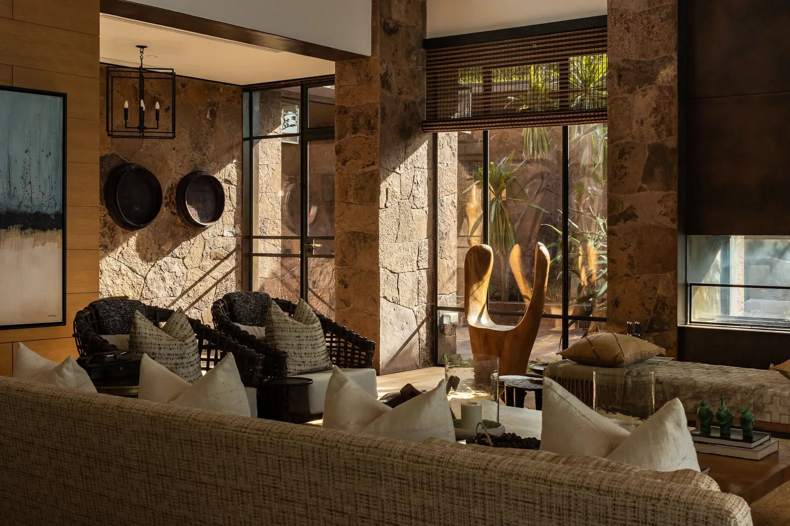 The lounge and central fireplace at Singita Kilima