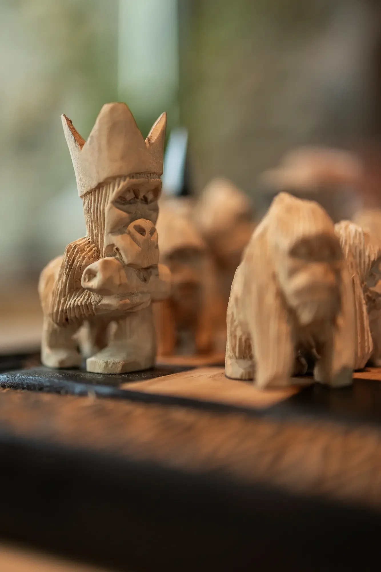 Carved wooden figures on a shelf