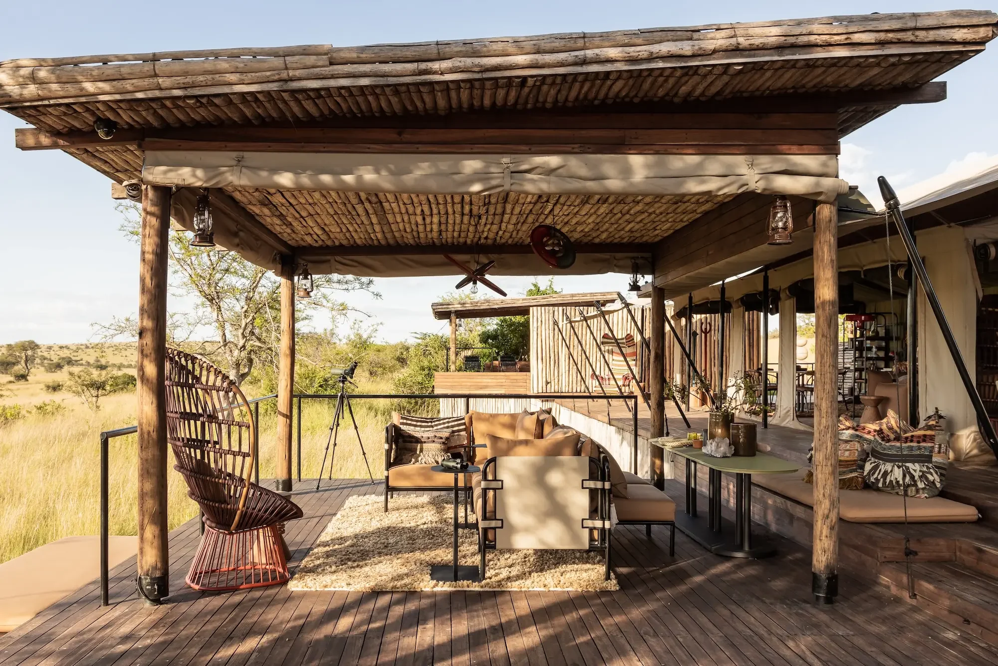 The main deck under a timber roof, looking over the plains