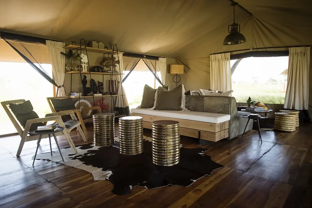 The lounge tent with a daybed and metal drums