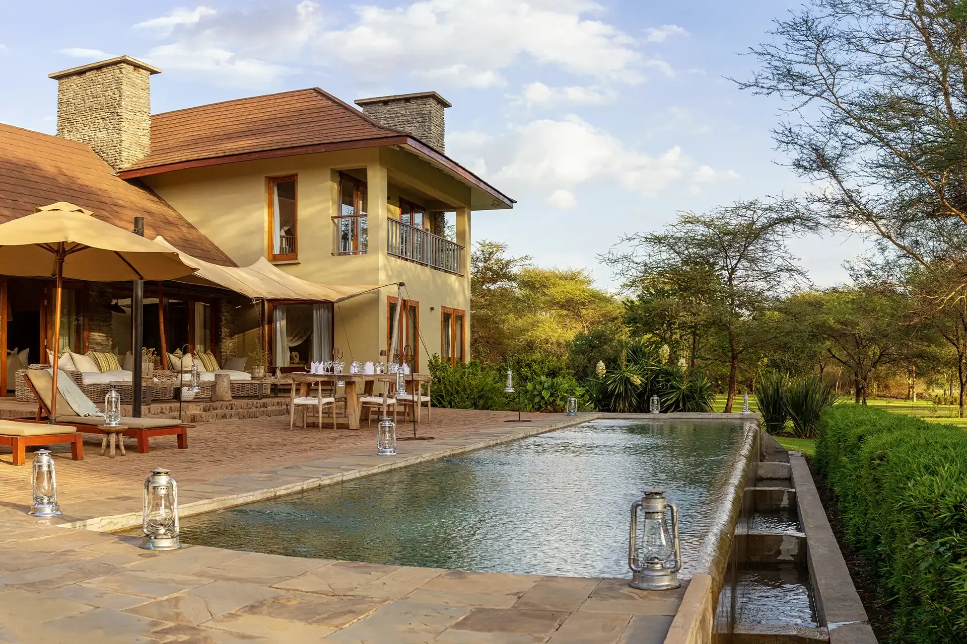 The villa and its pool in the afternoon light