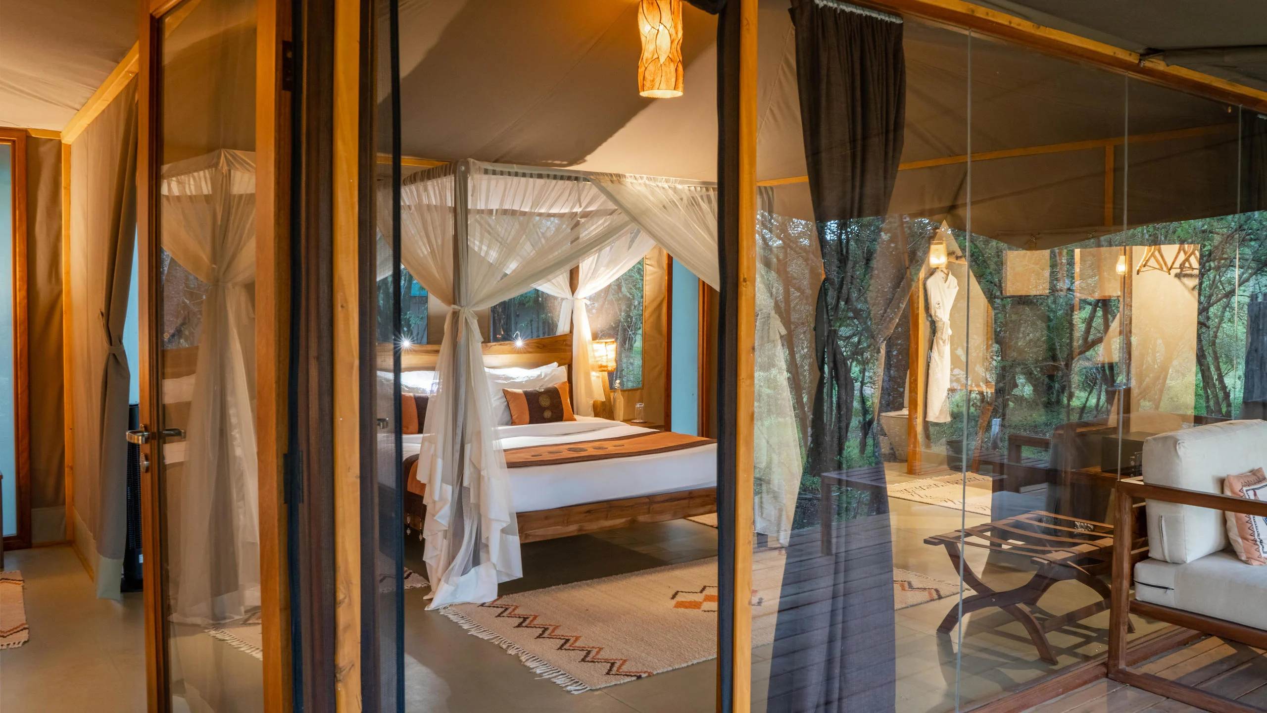 A tent bedroom seen through the netting