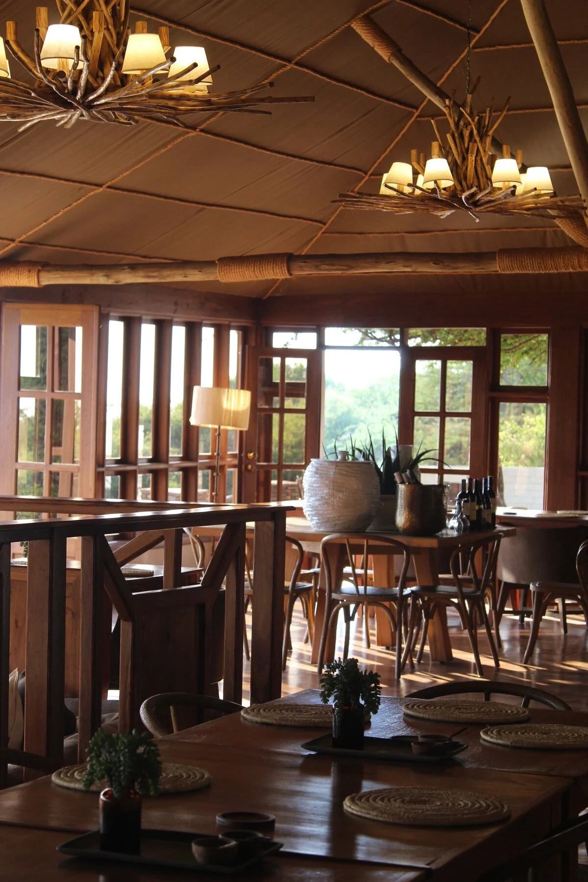 The dining area with lamps and timber tables