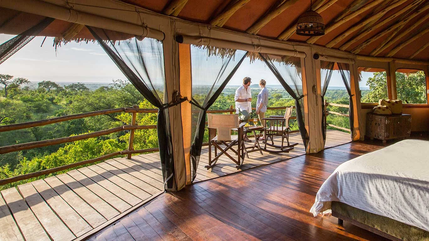 Guests on the deck of a treehouse room