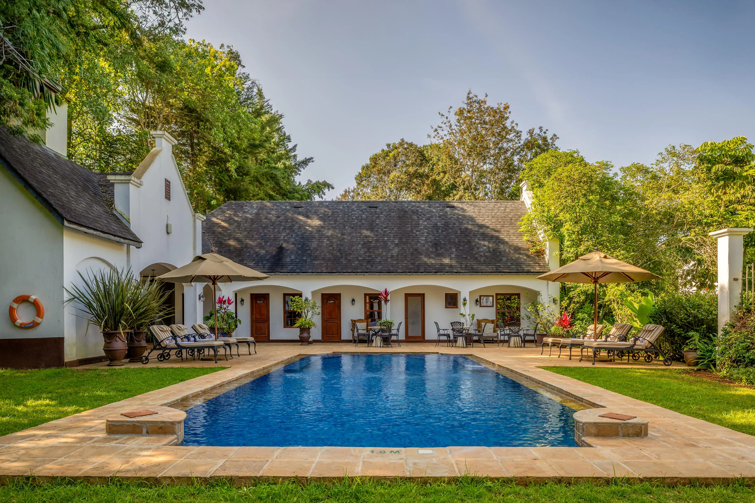 The manor house and its pool