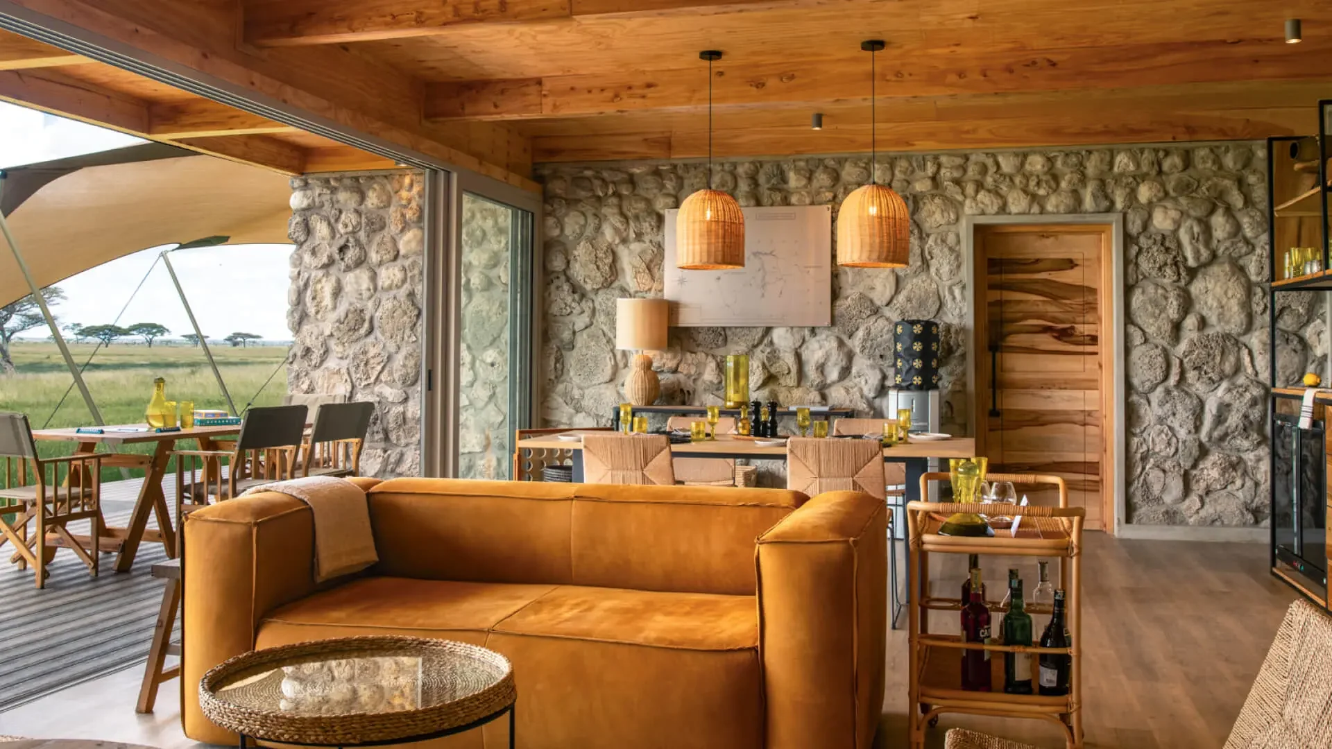 The lounge with a stone wall and pendant lamps