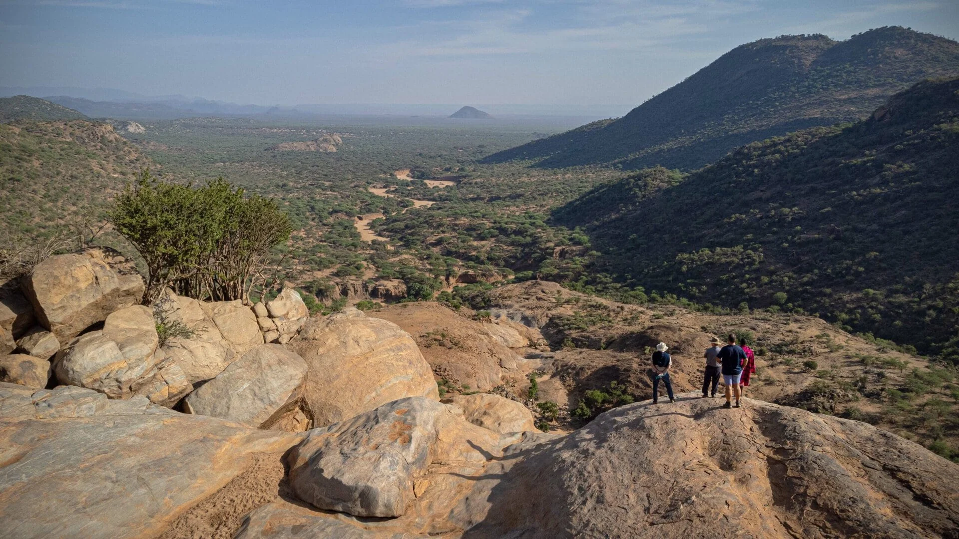Guests on the rocks above the valley