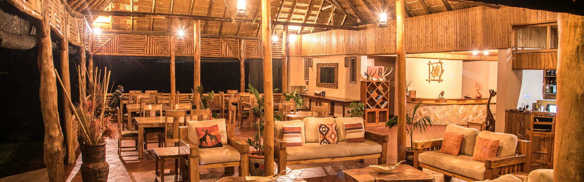 The lounge under thatch, lit in the evening