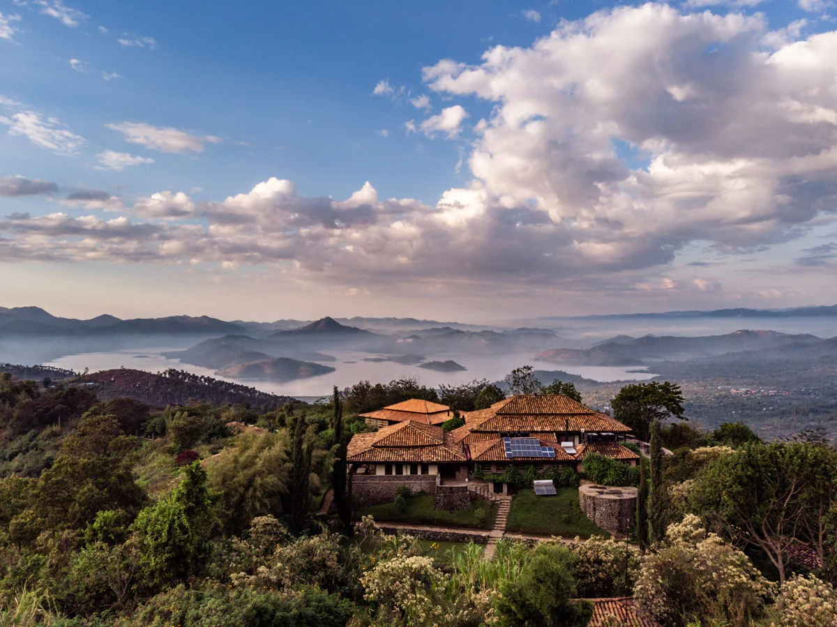 The lodge on its ridge with the lakes and hills beyond