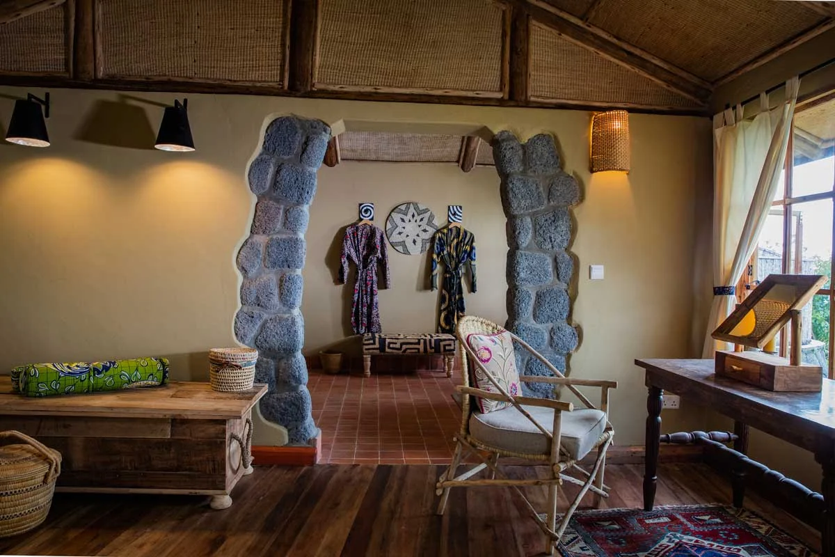 A banda with a stone-framed wardrobe and a rocking chair