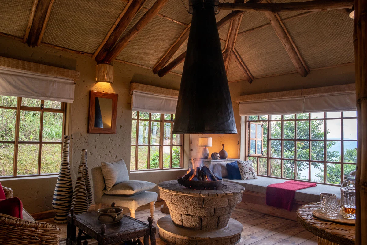 The lounge with a fireplace and windows onto the view