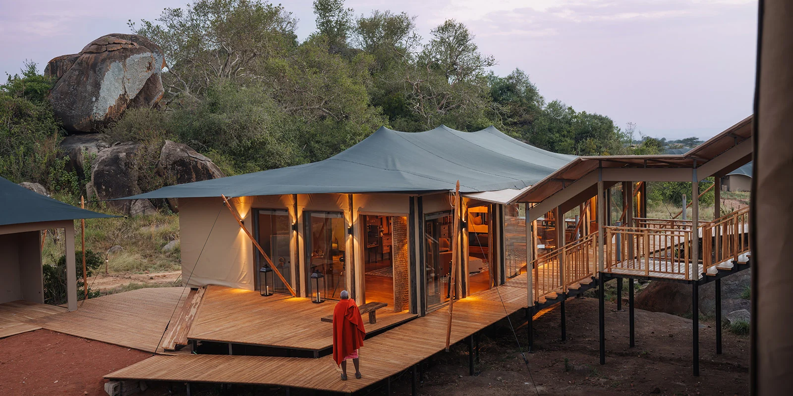 A tented suite on the rocks in the evening light