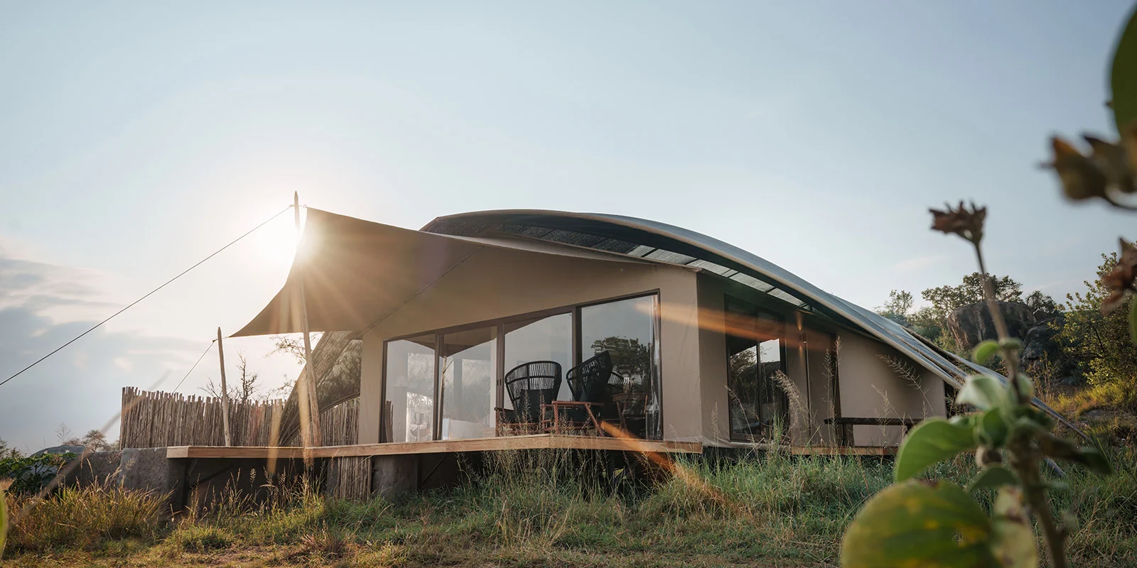 A tented suite at sunset