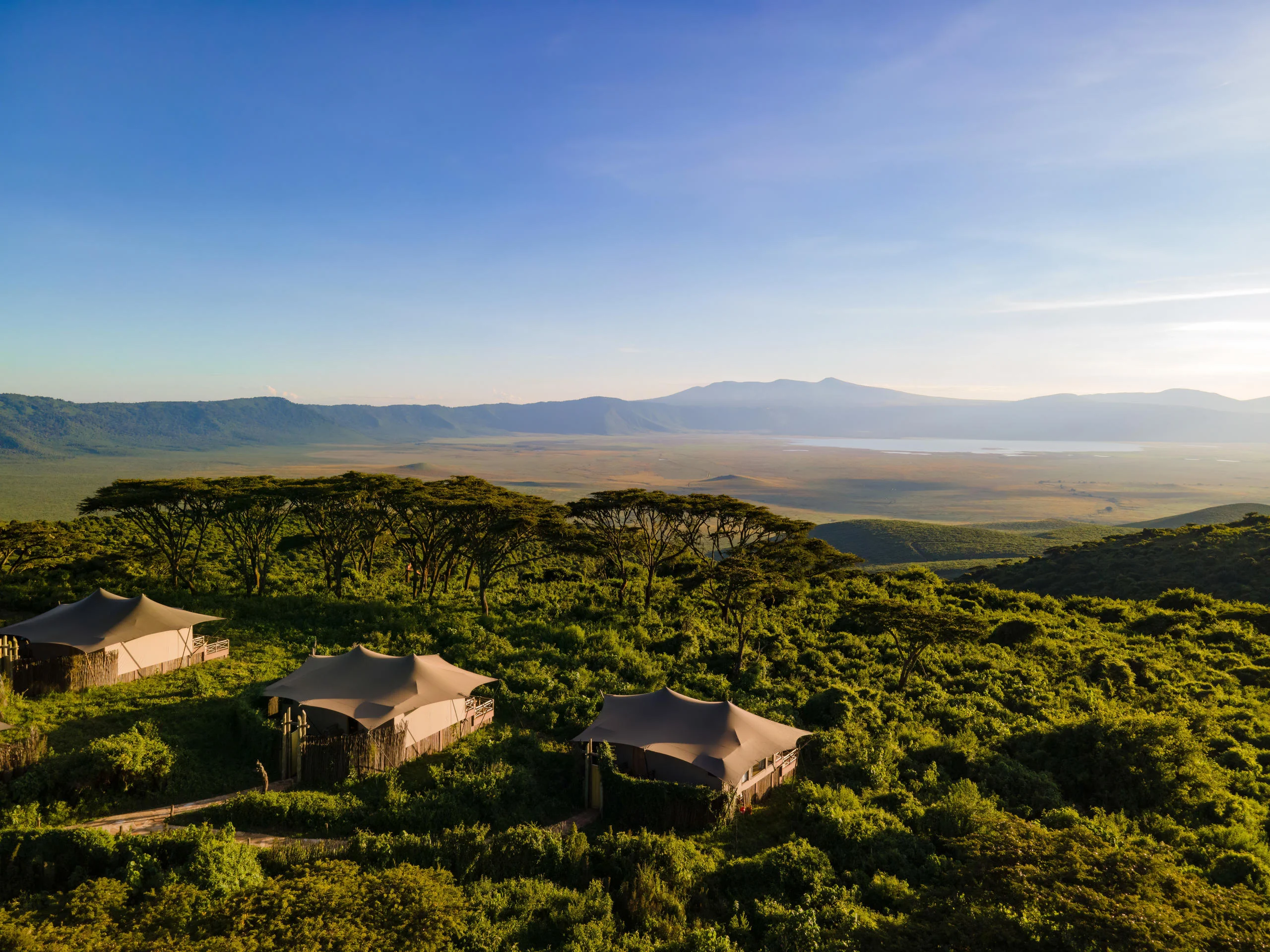 The tented suites on the crater rim with the crater floor beyond