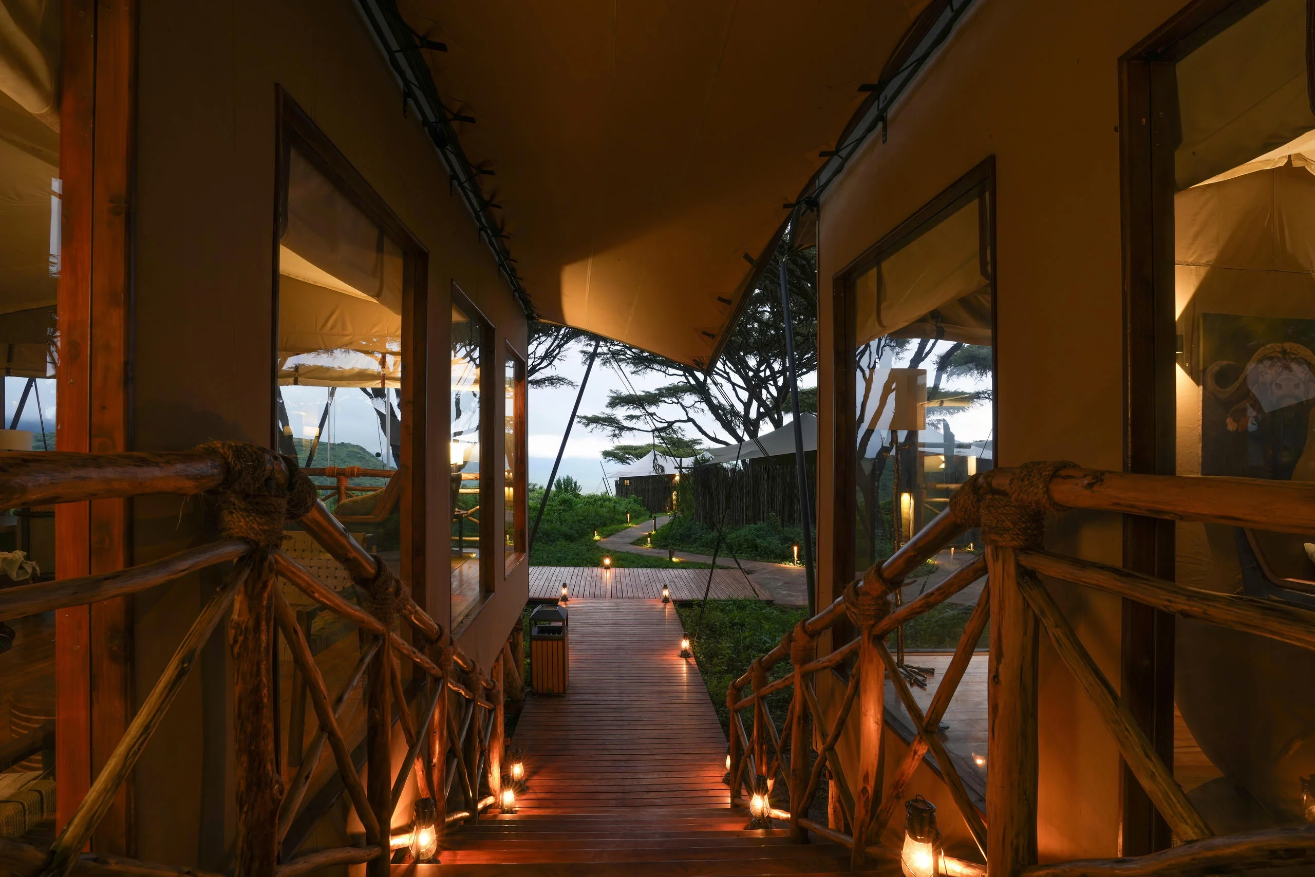 A candlelit walkway leading into a suite