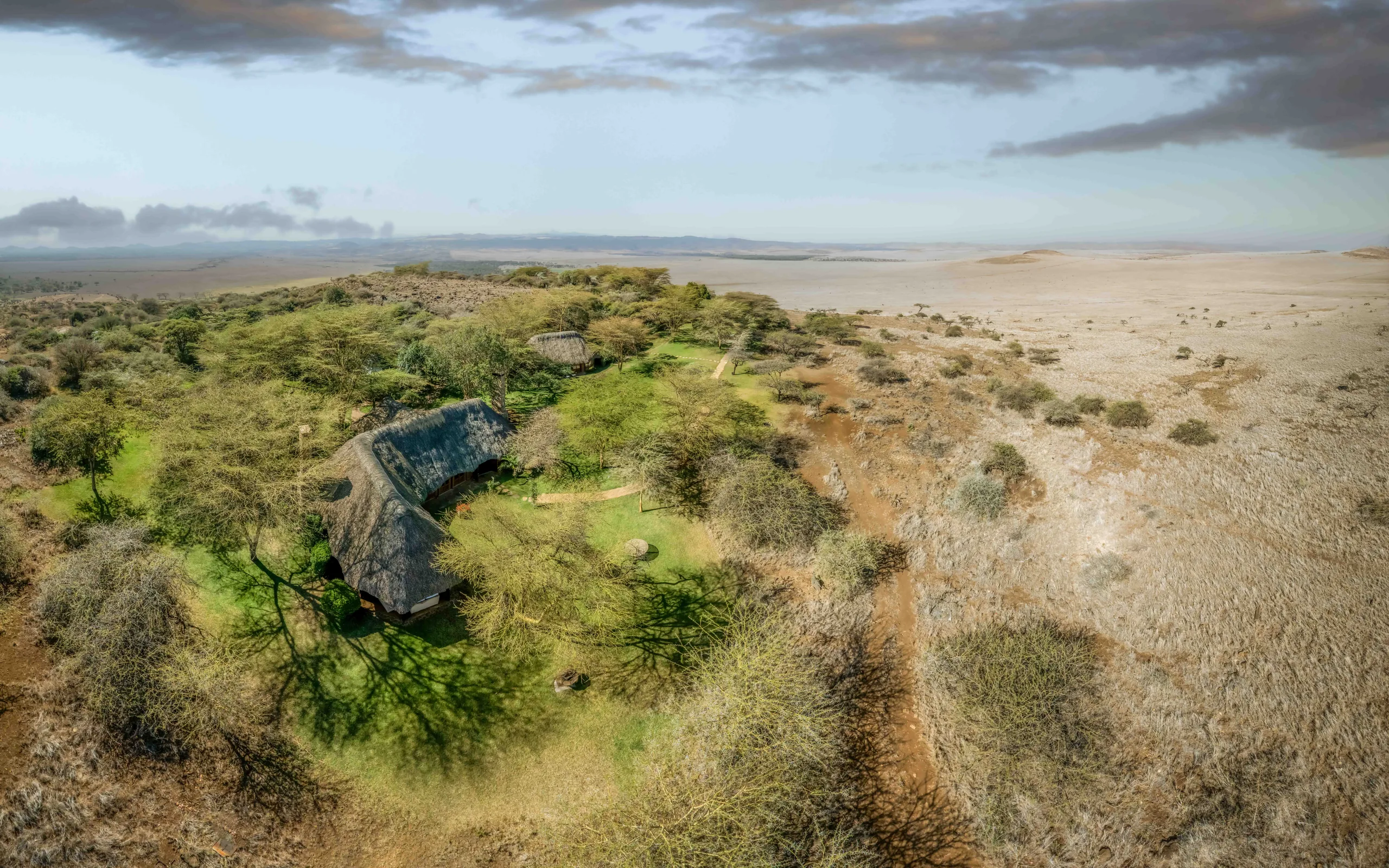 Aerial view of Kifaru House Lewa and its wooded hilltop setting