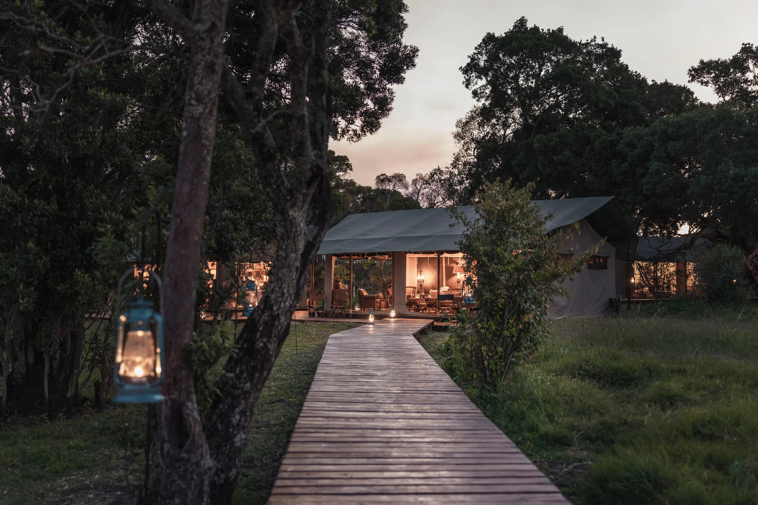 The illuminated lounge tent at Little Elephant Pepper Camp in the evening