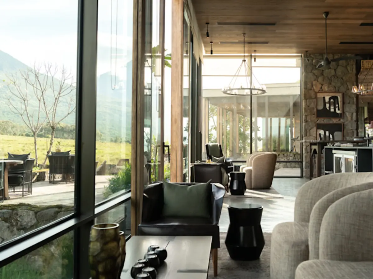 Singita Kwitonda Lodge, selected for its setting and access to Volcanoes National Park.