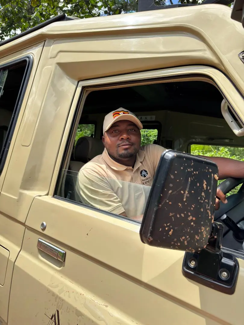 Gorden Kwikiriza in a safari vehicle